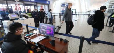 Coronavirus screening at Tianhe International Airport in Wuhan, capital of central China's Hubei Province.