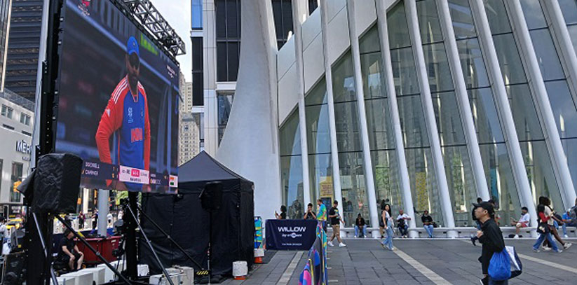 The Port Authority set up a giant screen showing the T20 World Cup tournament matches live and practice nets at the Occulus outside New York’s World Trade Center set up to introduce the game to visitors from around the world. (Photo: Arul Louis/IANS)