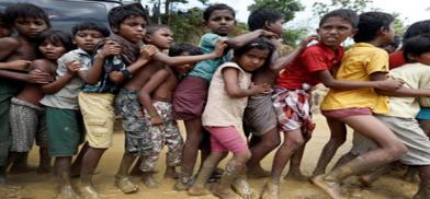 Rohingya refugee children queue for aid in Cox''s Bazar, Bangladesh