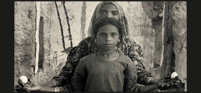 Gauri Gill, ‘Karima and Nimli, in a home destroyed by flooding due to extra rain, Lunkaransar’, from the series 'Notes from the Desert', 1999–ongoing. Copyright Gauri Gill. From the Taimur Hassan Collection — an image that evokes resilience, inheritance, and the quiet strength of rural women.