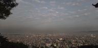 Black clouds floating over Kathmandu valley, at Swayambhu temple. Photo by Pragyan Srivastava.