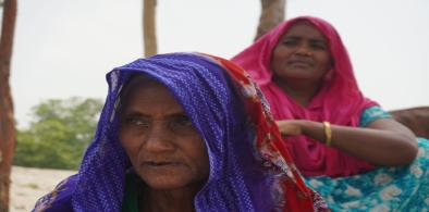 Sukhi Begum (centre) with her 50-year-old daughter Bani Begum at her home on Pakuar Char, Jamalpur, in April 2022 (Image: Mohammad Abdus Salam / The Third Pole)