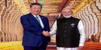 Modi and Xi shaking hands at Bharat Mandapam