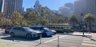 A vintage streetcar beside a driverless car on the Embarcadero, San Francisco / Photo by Surbhi Guha.