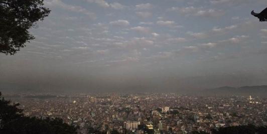 Black clouds floating over Kathmandu valley, at Swayambhu temple. Photo by Pragyan Srivastava.