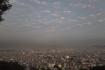 Black clouds floating over Kathmandu valley, at Swayambhu temple. Photo by Pragyan Srivastava.