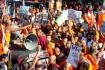 Sri Lankan Buddhist monks shout slogans and hold placards as they stage a protest rally outside the Bangladesh High Commission in Colombo